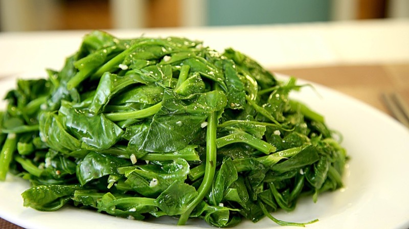 Wok-tossed pea shoots with garlic
